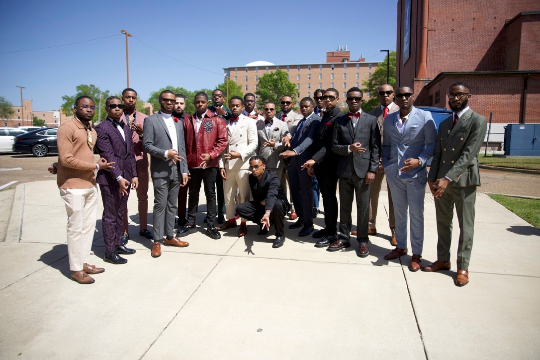 Delta Delta Chapter brothers in formal attire outdoors