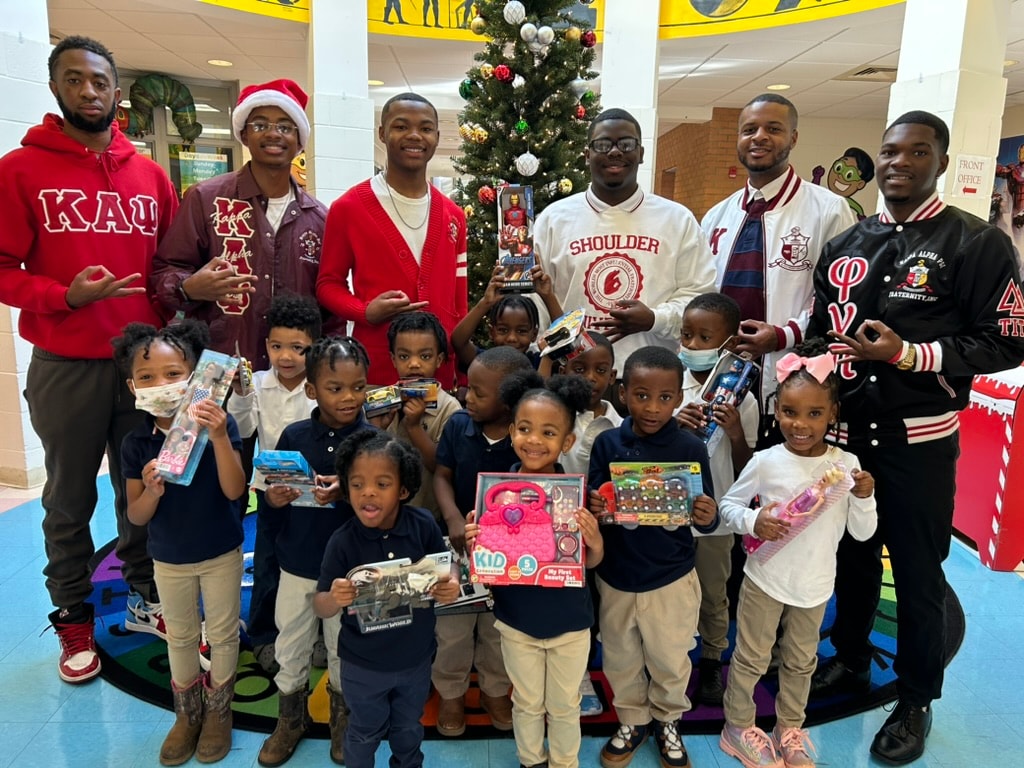 Brothers and children at holiday community service event